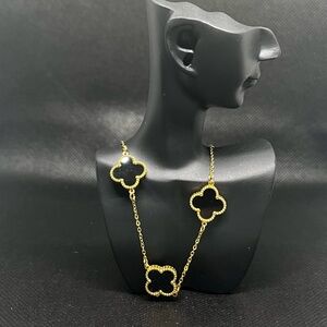 Elegant Gold and Black Clover Necklace